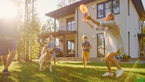 Family playing in back yard